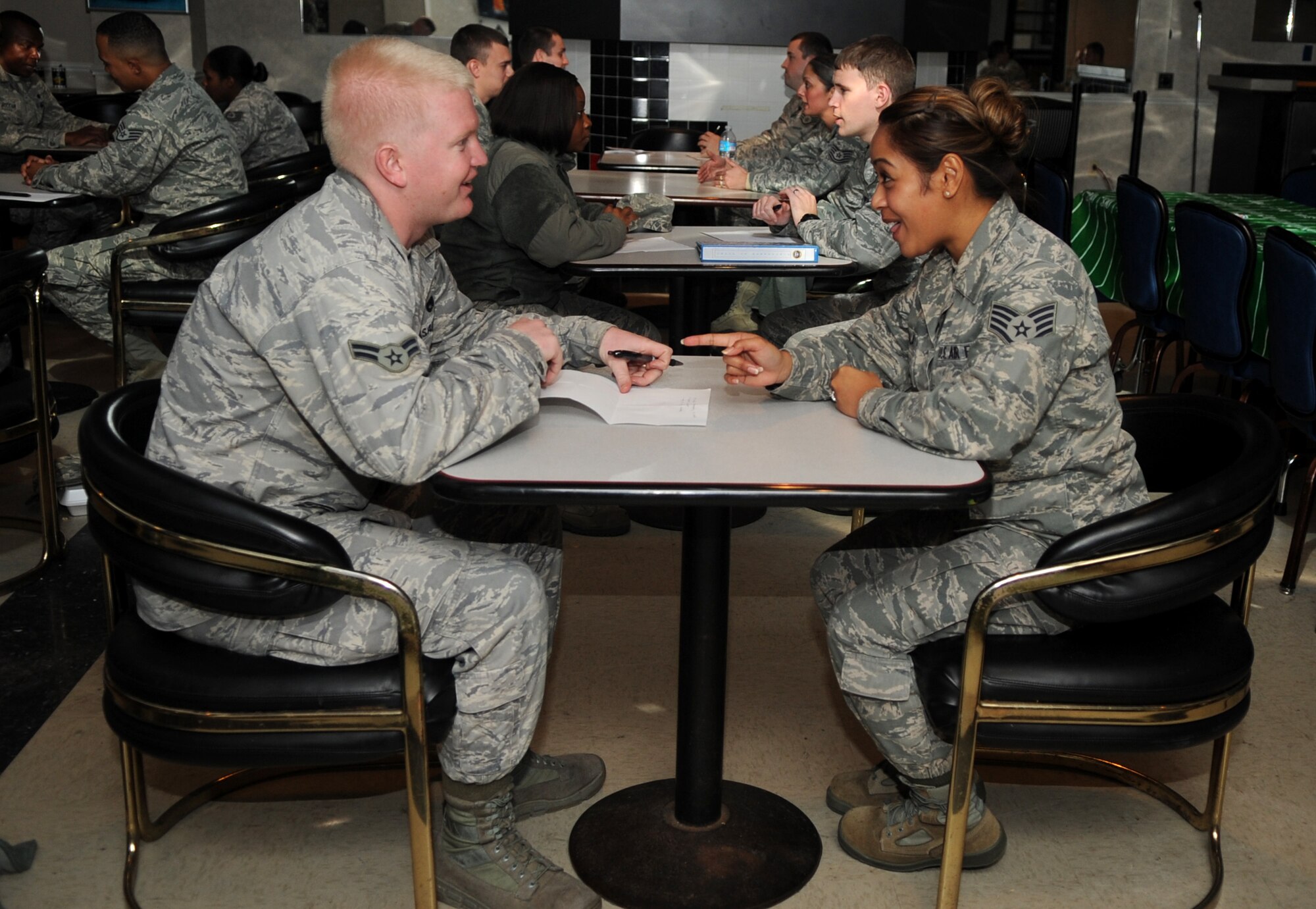 Airmen and volunteer mentors converse during the Airmen Mentoring Network’s Speed Mentoring event at Seymour Johnson Air Force Base, North Carolina, Dec. 11, 2014. The Airmen Mentoring Network was created to give Airmen increased opportunities to interact with leaders and learn from their experience. Mentors answered questions about everything from raising a military family to applying for new assignments. (U.S. Air Force photo/Senior Airman Ashley J. Thum)