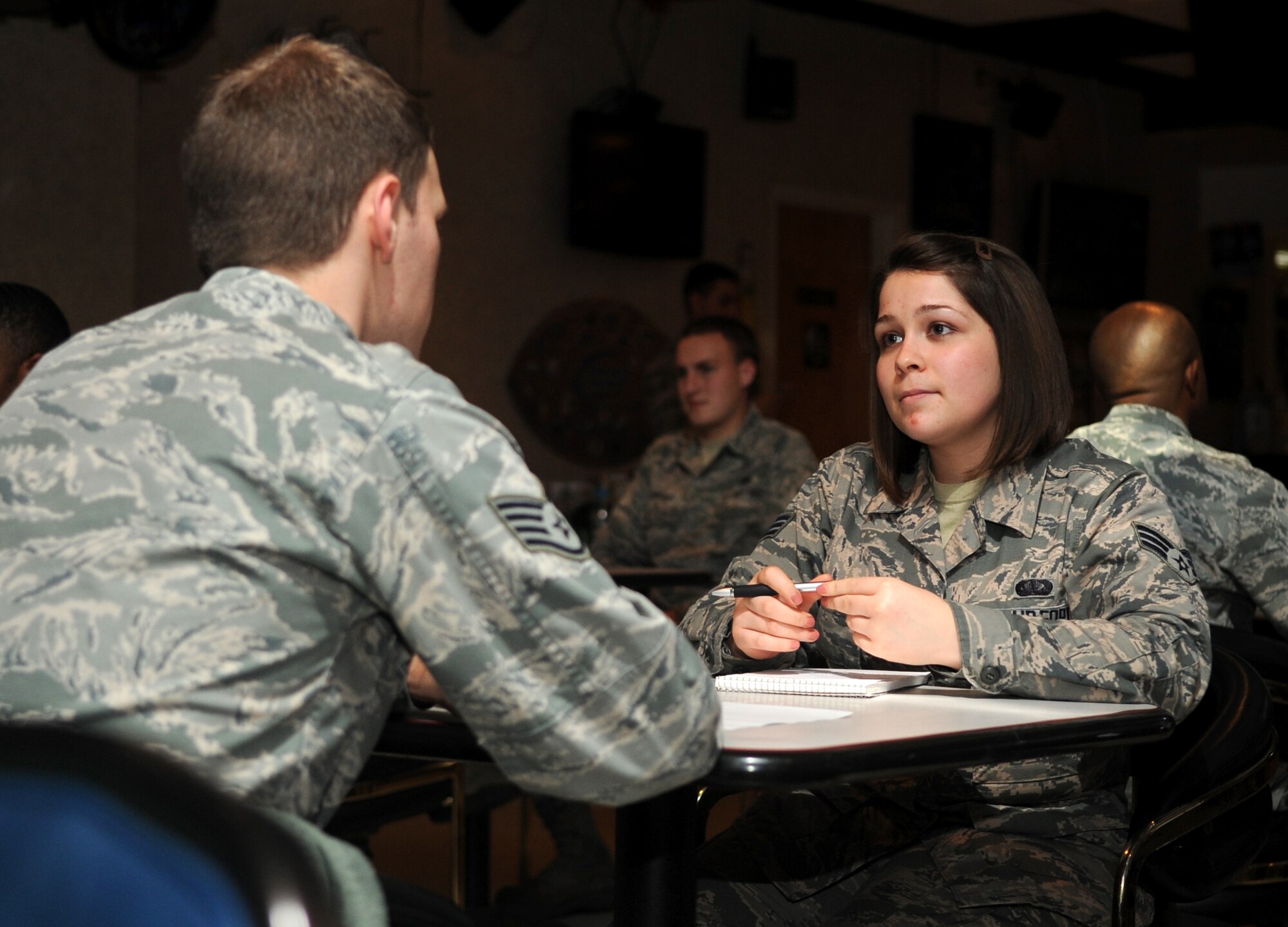 Senior Airman Wendy Fisher, 4th Force Support Squadron readiness journeyman, listens to advice from a volunteer mentor during the Airmen Mentoring Network’s Speed Mentoring event at Seymour Johnson Air Force Base, North Carolina, Dec. 11, 2014. Mentors answered questions about everything from raising a military family to applying for new assignments. (U.S. Air Force photo/Senior Airman Ashley J. Thum)