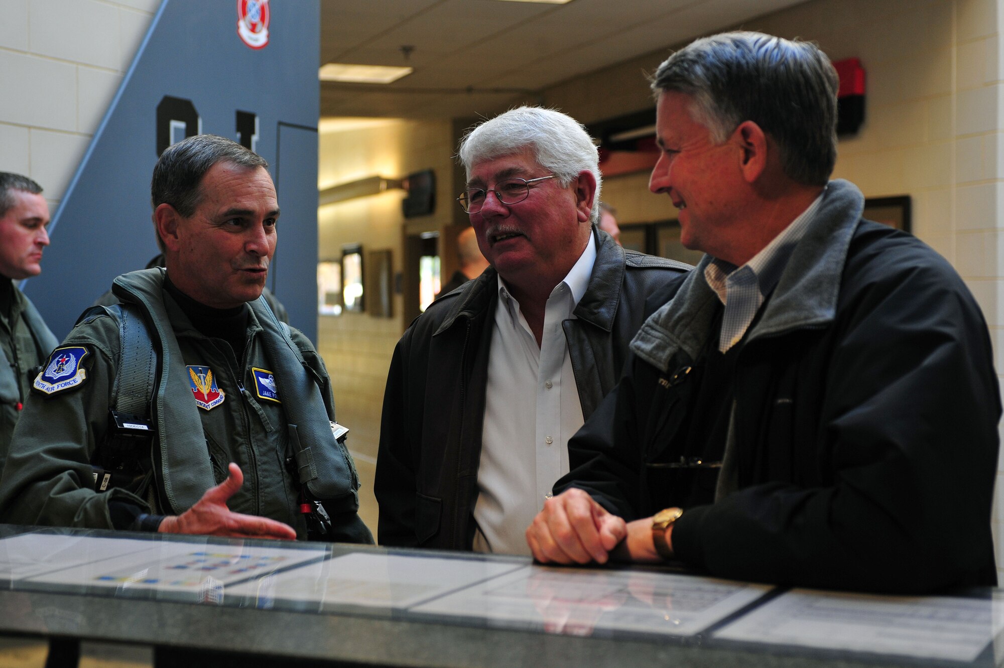 Maj. Gen. H.D. Polumbo Jr., Ninth Air Force commander, speaks with members of the base military affairs committee before a pre-flight briefing for exercise Razor Talon at Seymour Johnson Air Force Base, North Carolina, Dec. 5, 2014. Polumbo was accompanied by Mr. Vince Pavkov, the Ninth AF honorary commander, during his visit to participate in the exercise. Razor Talon, a monthly joint-force exercise that combines resources from multiple installations across the East Coast, is designed to integrate air, land and sea forces to promote a more cohesive atmosphere between the different military services. (U.S. Air Force photo/Senior Airman John Nieves Camacho)
