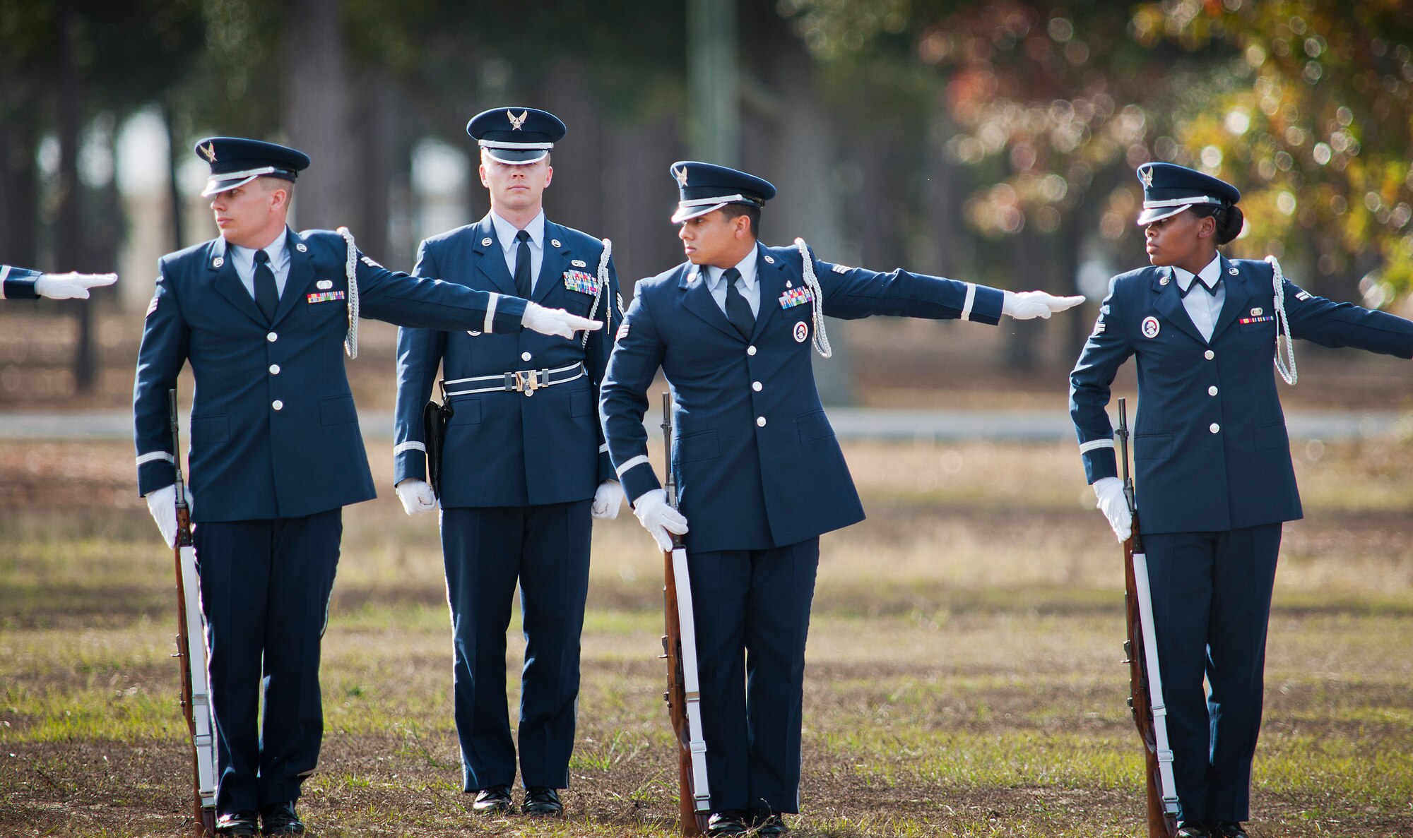New honor guard members ensure proper spacing as part of the rifle team for the funeral ceremony at the honor guard graduation Dec. 3 at Eglin Air Force Base, Fla.  Approximately 12 new Airmen graduated from the 80-plus-hour course. The graduation performance is a full military honors funeral to include flag detail, rifle volley, pall bearers and bugler.  (U.S. Air Force photo/Samuel King Jr.)