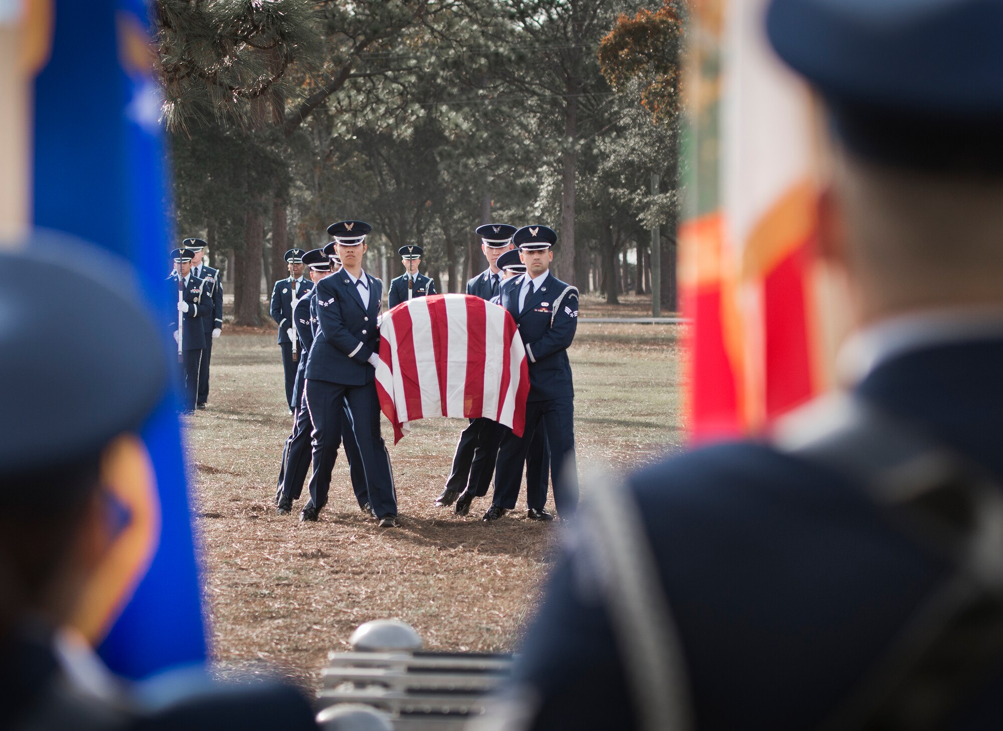 New honor guard members carry the casket during the funeral ceremony at the honor guard graduation Dec. 3 at Eglin Air Force Base, Fla.  Approximately 12 new Airmen graduated from the 80-plus-hour course. The graduation performance is a full military honors funeral to include flag detail, rifle volley, pall bearers and bugler.  (U.S. Air Force photo/Samuel King Jr.)