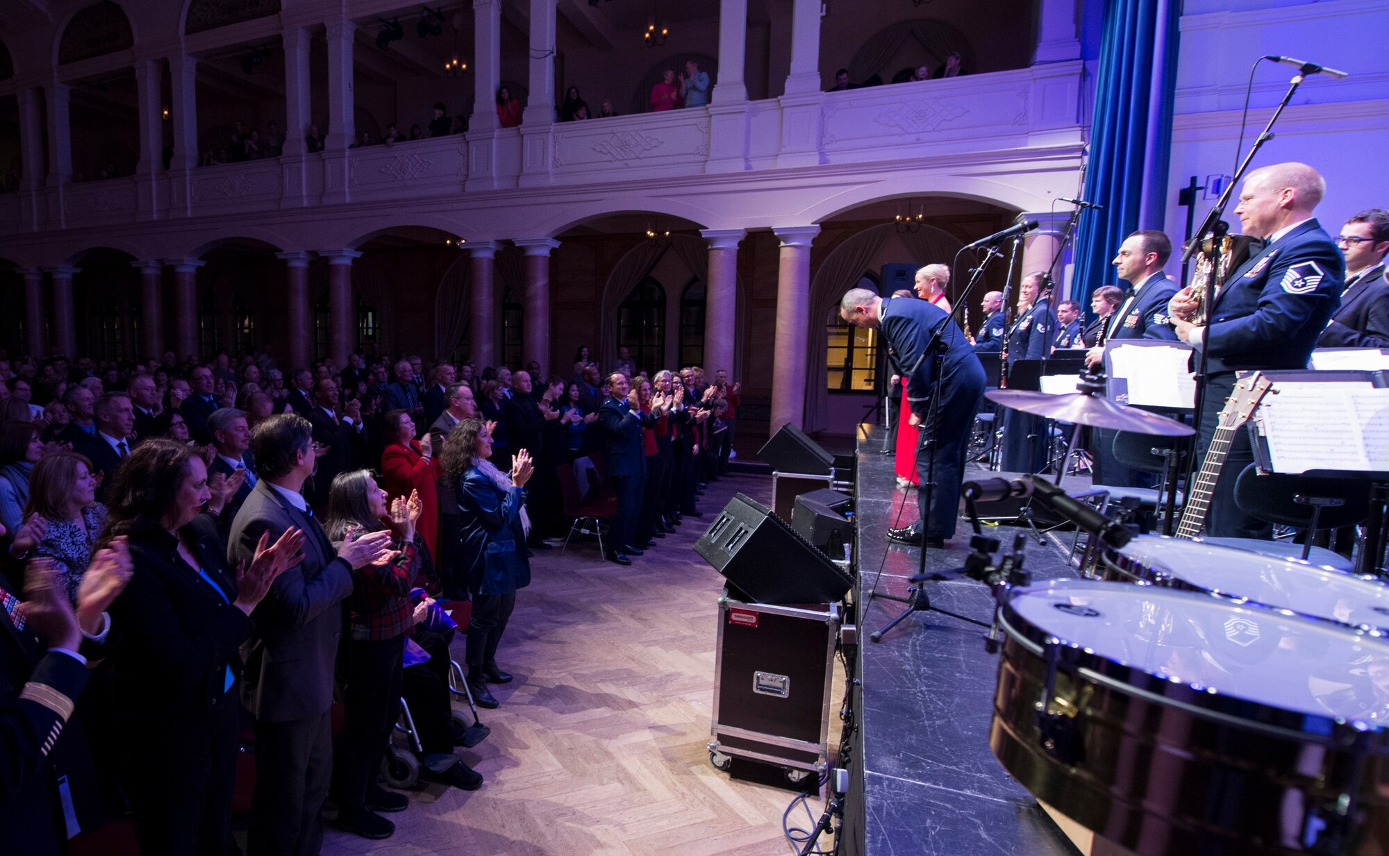 An audience gives the U.S. Air Forces in Europe Band and the Rheinland-Pfalz International Choir a standing ovation during the annual KMC Christmas Concert at the Fruchthalle, Kaiserslautern, Germany, Dec. 12, 2014. (U.S. Air Force photo/Senior Airman Damon Kasberg)