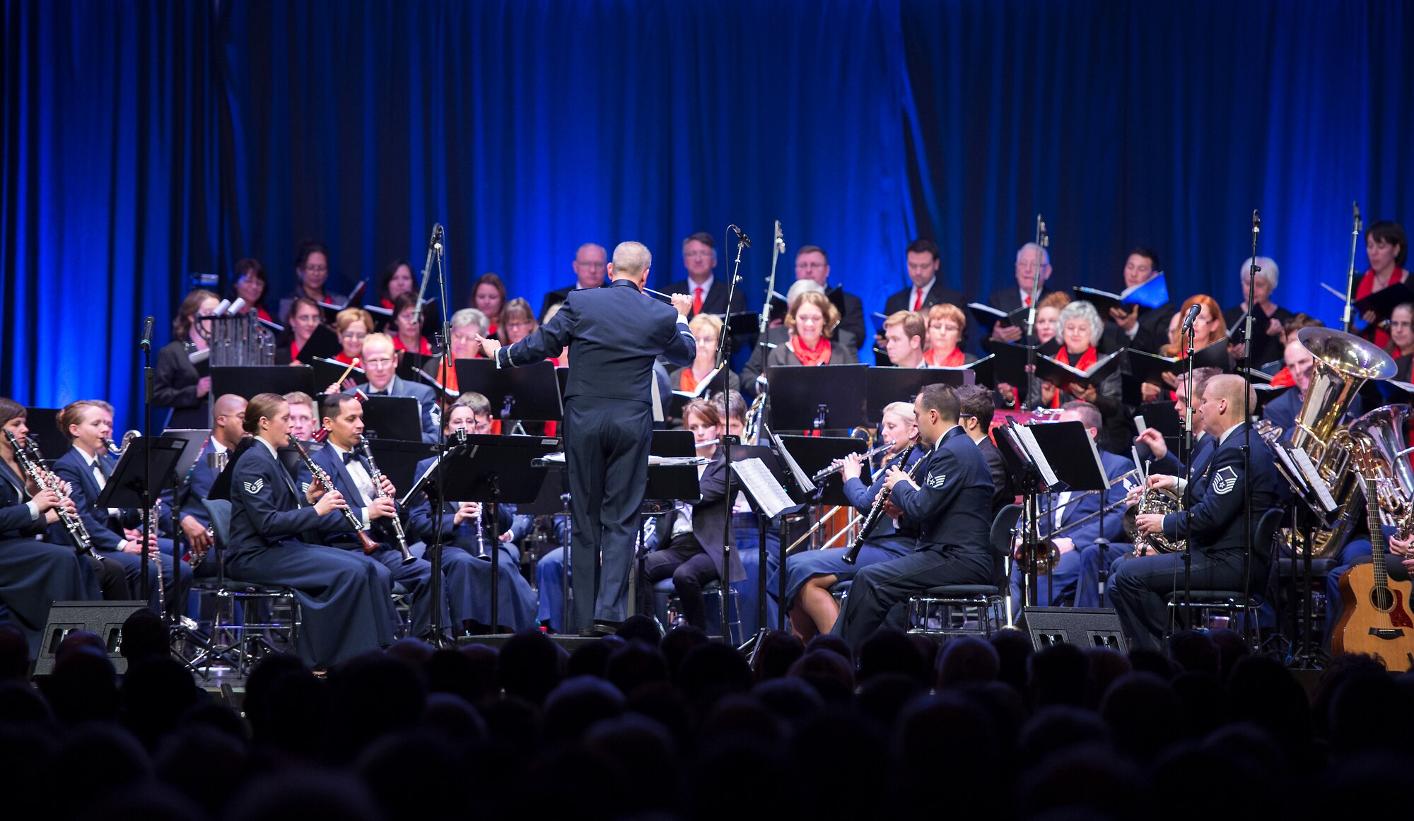 Members of the U. S. Air Forces in Europe Band and the Rheinland-Pfalz International Choir perform during the annual KMC Christmas Concert, Kaiserslautern, Germany, Dec. 12, 2014. The annual event was held in the Fruchthalle, where hundreds of Germans came to listen to the USAFE Band perform Christmas music such as “Underneath the Tree”, “This Christmastide” and “Bethlehem Morning.” (U.S. Air Force photo/Senior Airman Damon Kasberg)