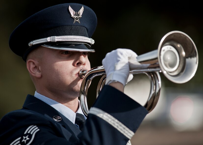 Staff Sgt. Jacob Ballard performs as the bugler during the funeral ceremony at the honor guard graduation Dec. 3 at Eglin Air Force Base, Fla.  Approximately 12 new Airmen graduated from the 80-plus-hour course. The graduation performance is a full military honors funeral to include flag detail, rifle volley, pall bearers and bugler.  (U.S. Air Force photo/Samuel King Jr.)