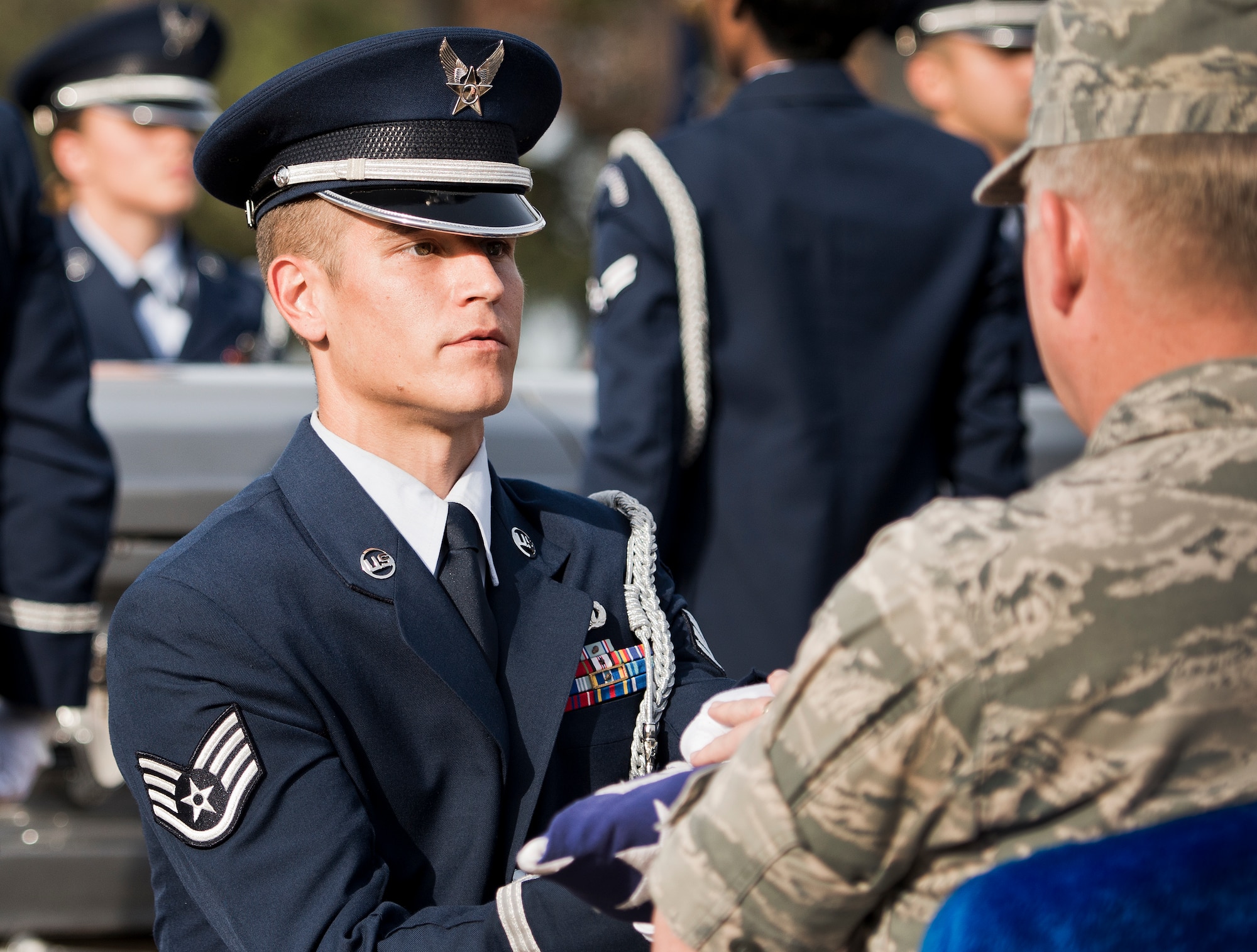 Staff Sgt. Anthony Sallee presents the flag during the funeral ceremony at the honor guard graduation Dec. 3 at Eglin Air Force Base, Fla.  Approximately 12 new Airmen graduated from the 80-plus-hour course. The graduation performance is a full military honors funeral to include flag detail, rifle volley, pall bearers and bugler.  (U.S. Air Force photo/Samuel King Jr.)