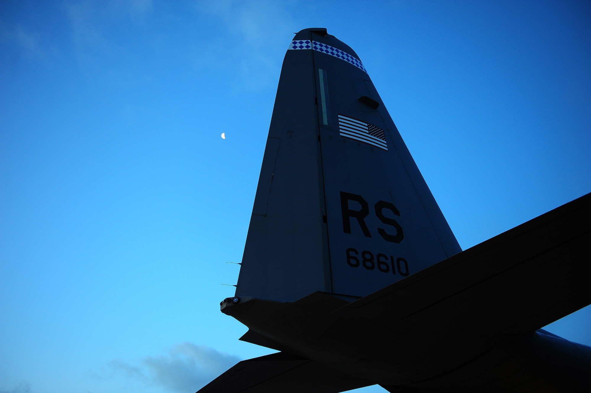 A view of the morning sky as the aerial delivery team begins loading bundles of toys for Santa to deliver to local children this Christmas on Dec. 15, 2014, Ramstein Air Base, Germany. The bundles were created from donations and will help provide a happy holiday season for those who need a little help. (U.S. Air Force photo/Staff Sgt. Kris Levasseur)