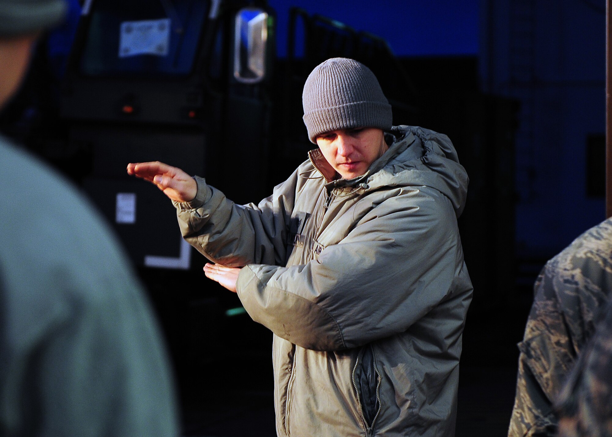 Staff Sgt. Matthew Volk, 86th Logistics Readiness Squadron aerial delivery technician, guides fellow team members while loading a container specifically built for Santa Claus to deliver toys to children on Dec. 15, 2014, from Ramstein Air Base, Germany. Much like Santa’s elves, these Airmen and Soldiers were responsible for packing Santa’s sleigh, which happened to be a C-130J Super Hercules. (U.S. Air Force photo/Staff Sgt. Kris Levasseur)