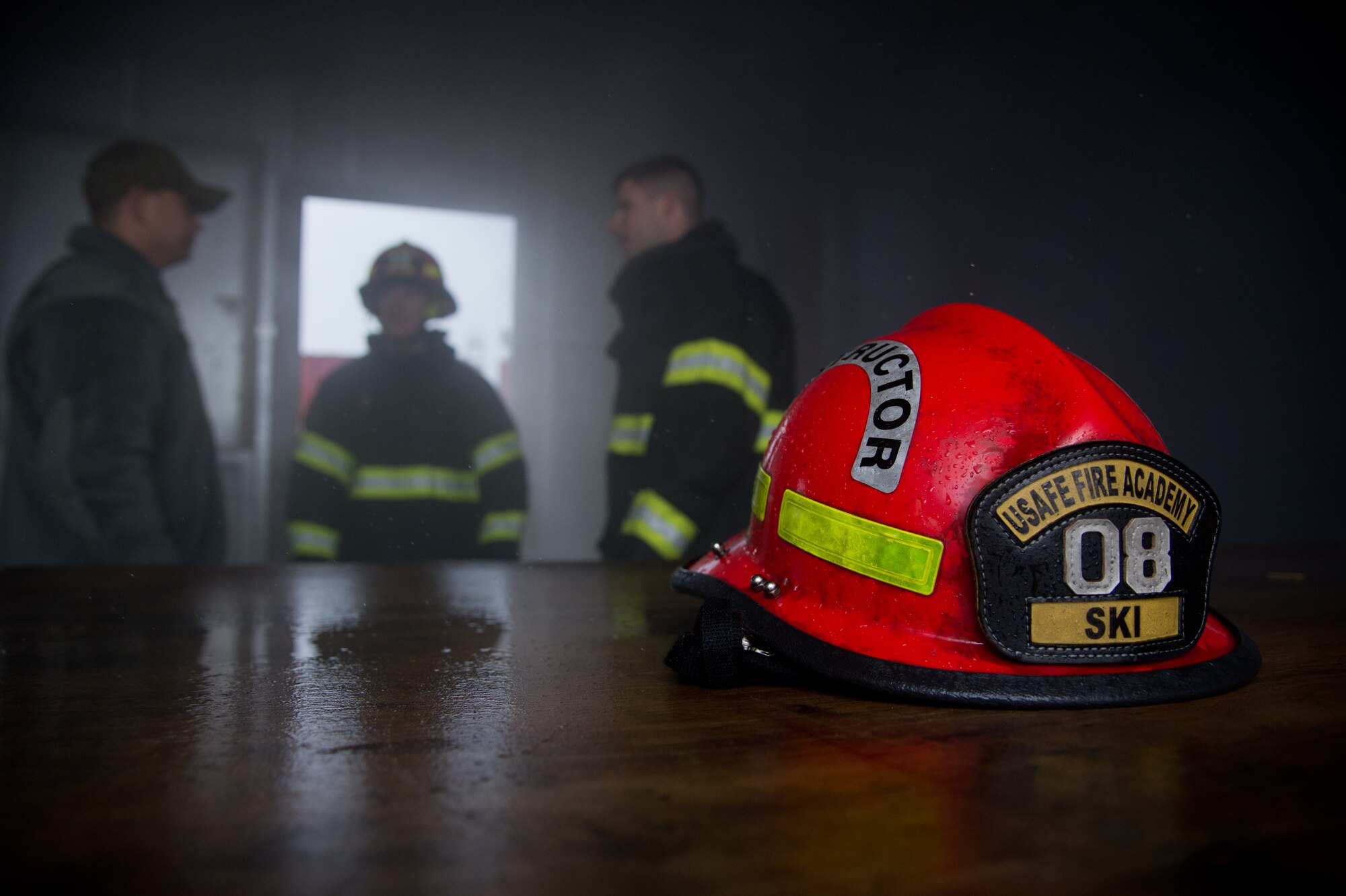 Airmen from the 435th Air Ground Operations Wing’s Contingency Response Group talk about where to place the manikins for the next search and rescue demonstration Dec. 4, 2014, at Ramstein Air Base, Germany. Airmen from the 435th CRG familiarized 12 Lithuanian Airmen on various firefighting procedures they use and so the two countries can work together better any contingency operation missions. (U.S. Air Force photo/Senior Airman Jonathan Stefanko)