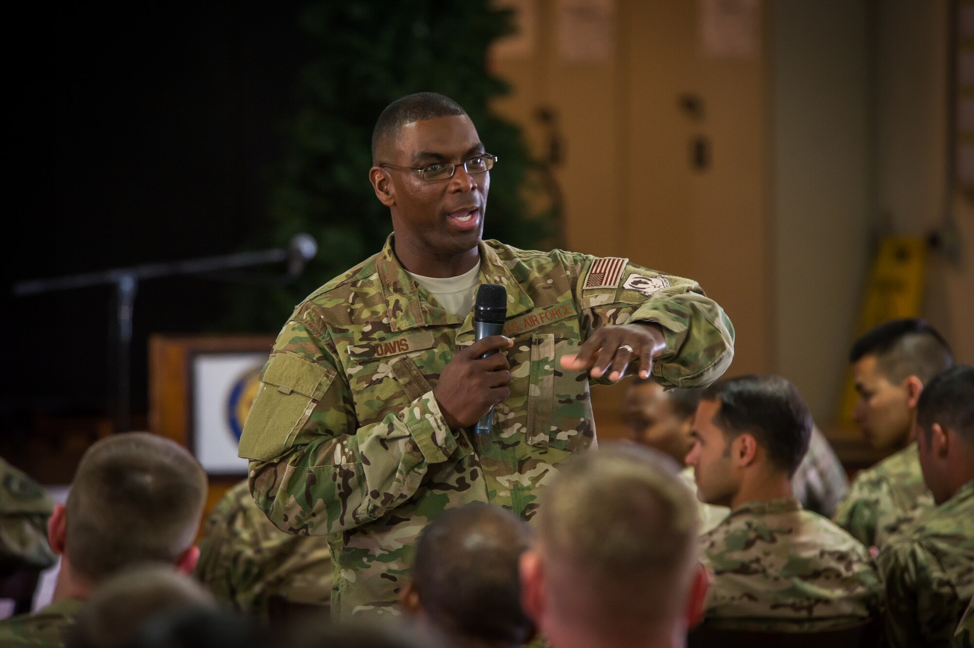 Chief Master Sgt. James E. Davis, U.S. Air Forces in Europe and Air Forces Africa command chief, speaks to Airmen at Camp Lemmonier, Djibouti during a commander's call and base visit Dec. 10, 2014. Davis and the USAFE-AFAFRICA commander, Gen. Frank Gorenc, toured bases in Europe and Africa to speak to Airmen and answer their questions regarding the future of the Air Force. (U.S. Air Force photo/ Staff Sgt. Ryan Crane)