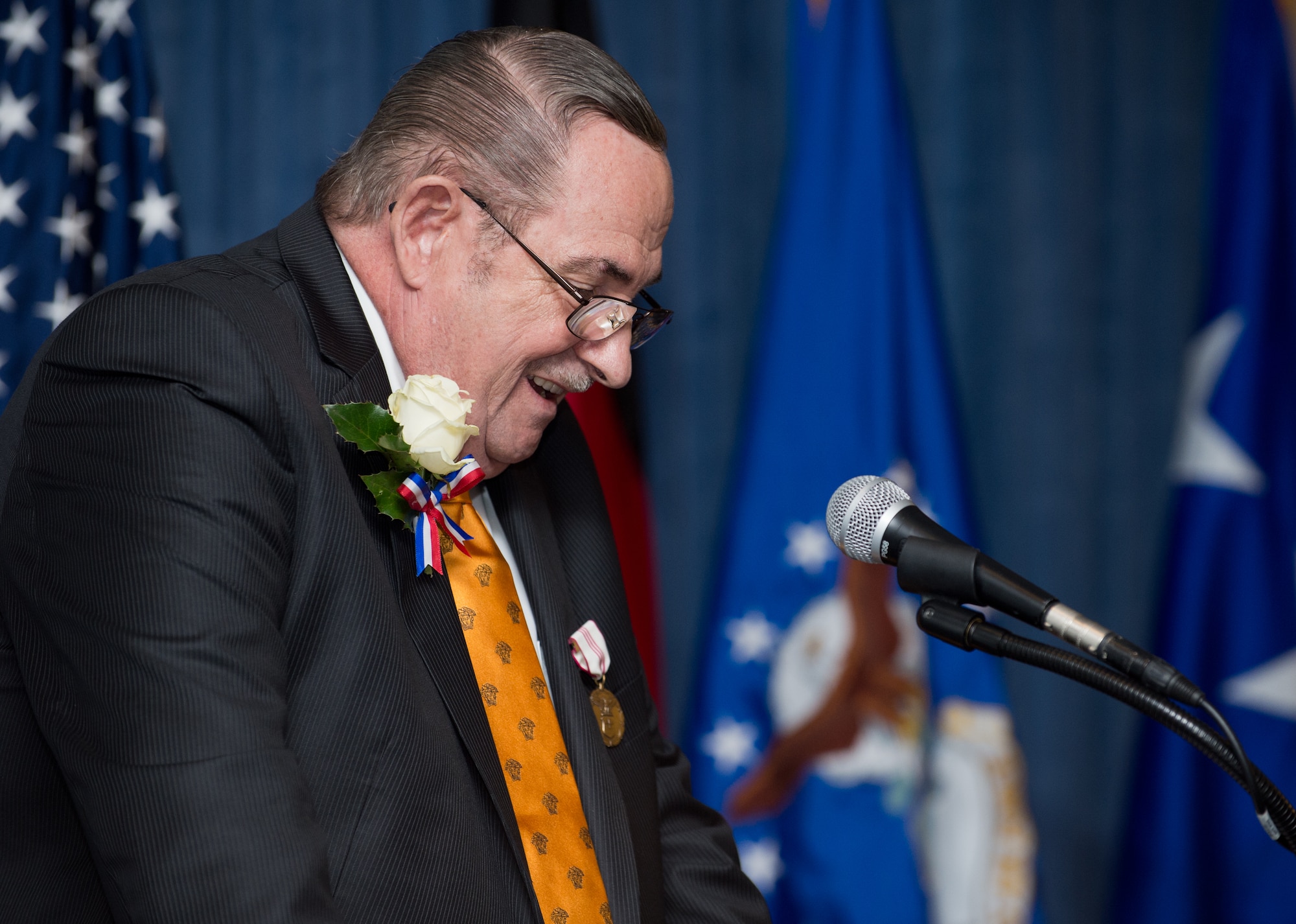 John Mace gives final remarks during his retirement ceremony Dec. 12, 2014, at Ramstein Air Base, Germany. Mace retired from the military after 25 years and retired again in civil service after 29 years. Mace was the special operations medical officer for the 86th Medical Group, where he provided comprehensive medical care to the 86th Airlift Wing, U.S. Air Forces in Europe, joint service partners and numerous embassies and consulates throughout Europe, Africa and the Middle East. (U.S. Air Force photo/Senior Airman Jonathan Stefanko)