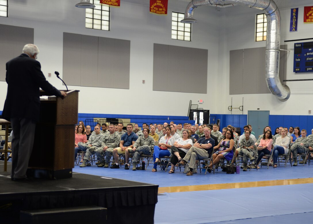 Members of Team Andersen attend a lecture on spiritual resilience given by Dr. Ravi Zacharias Dec. 11, 2014, at the Coral Reef Fitness Center at Andersen Air Force Base, Guam. Zacharias is a speaker, apologist and author. (U.S. Air Force photo by Senior Airman Cierra Presentado/Released)