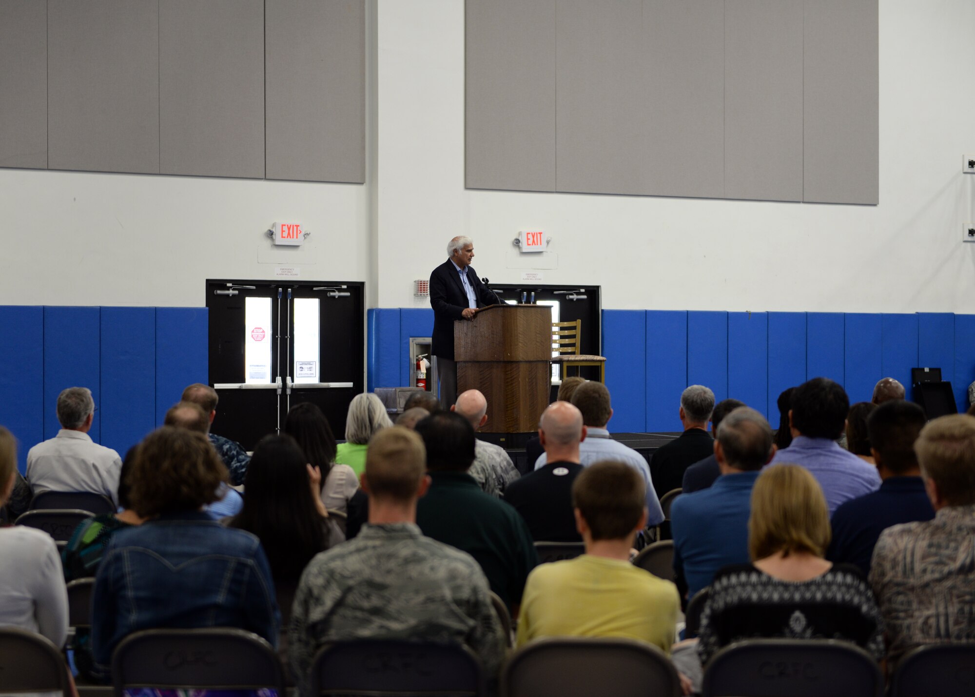 Members of Team Andersen attend a lecture on spiritual resilience given by Dr. Ravi Zacharias Dec. 11, 2014, at the Coral Reef Fitness Center at Andersen Air Force Base, Guam. Zacharias is a speaker, apologist and author. (U.S. Air Force photo by Senior Airman Cierra Presentado/Released) 