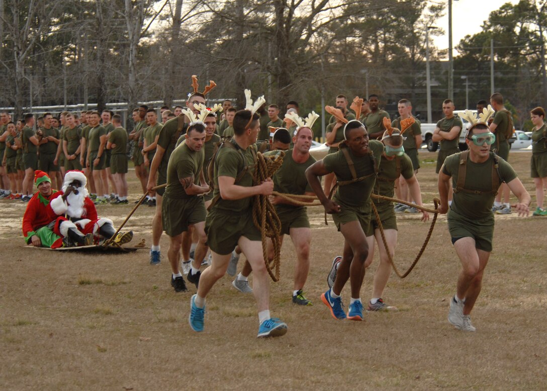 H and S Company nears the finish line in their run of the MCES Sleigh Pull.