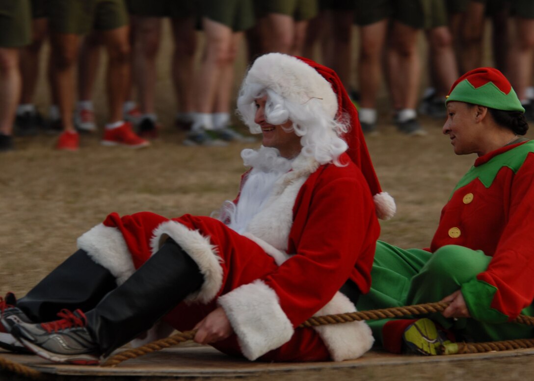 Combat Engineer Instruction Company nears the finish line of their run in the MCES Sleigh Pull.