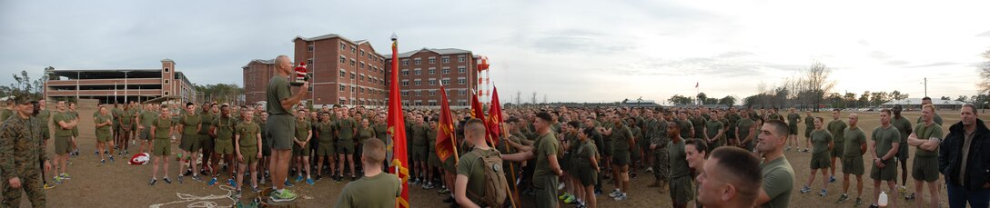 The school gathers around the Commanding Officer anxious to learn the winning company team in the MCES Sleigh Pull.