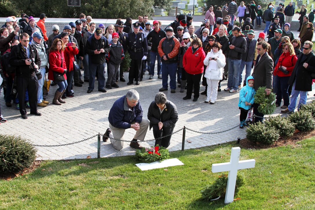 Karen and John Mooreshead place a wreath at the grave marker of the late Robert Francis "Bobby" Kennedy during Wreaths Across America at Arlington National Cemetery in Arlington, Va., Dec. 13, 2014. 