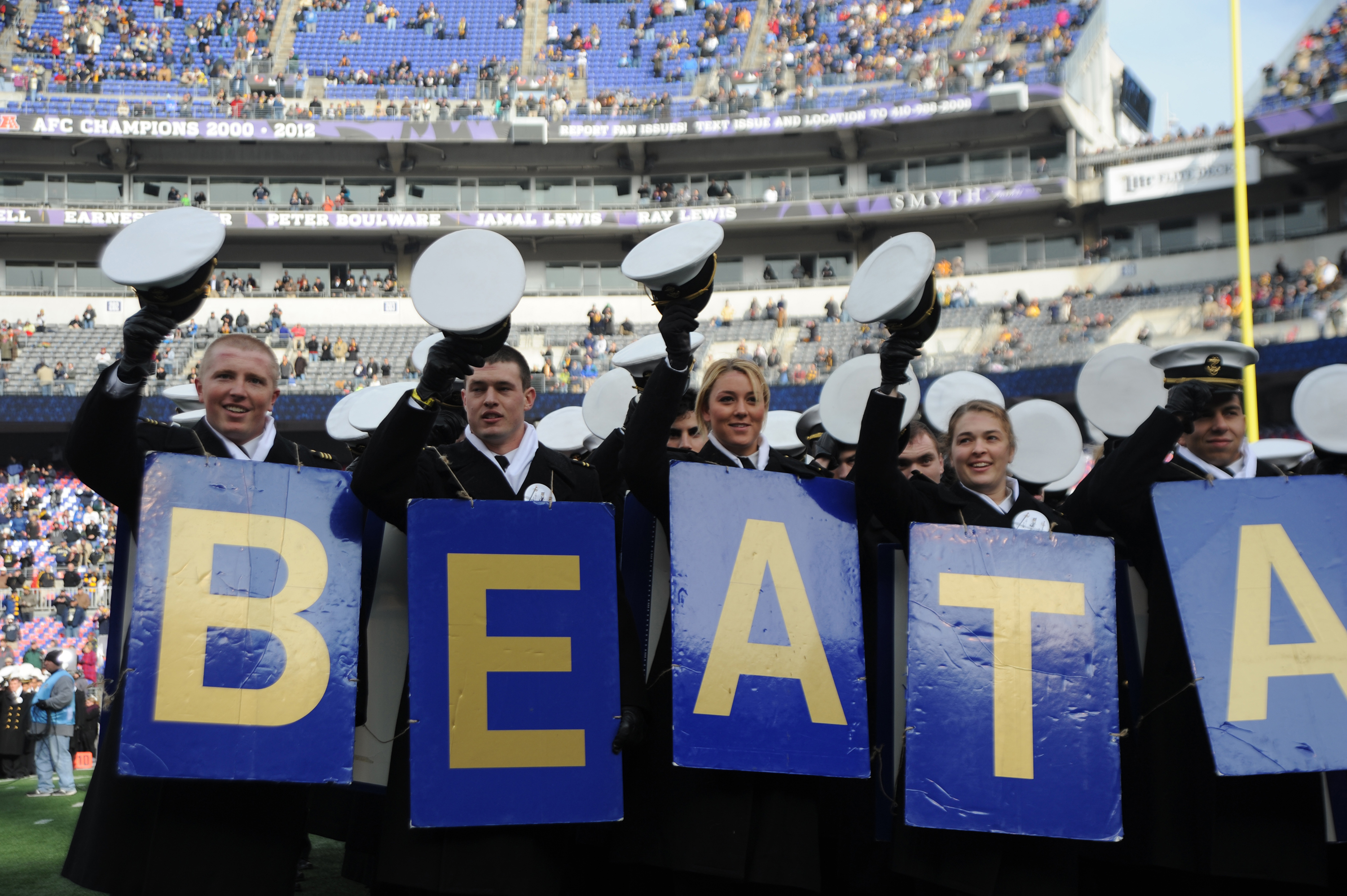 Midshipmen Tip Their Covers To Fans Of Army Before The Start Of