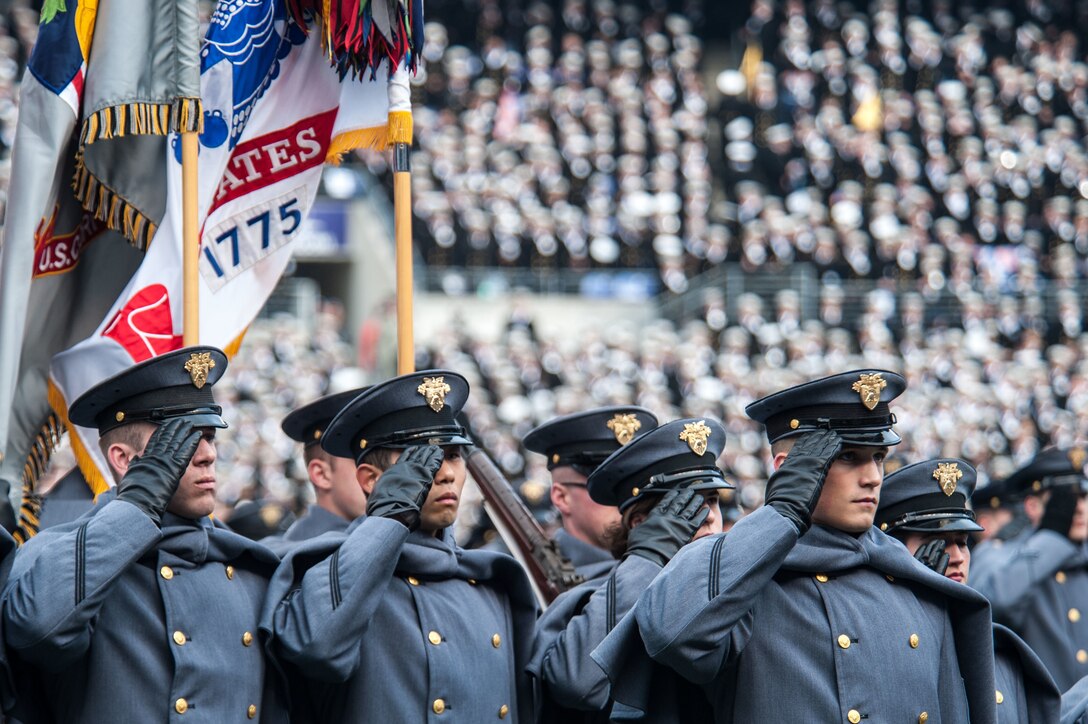 Cadets from the U.S. Military Academy salute during the singing of the national anthem before the start of the 115th Army vs. Navy football game at M&T Bank stadium in Baltimore, Md., Dec. 13, 2014.  