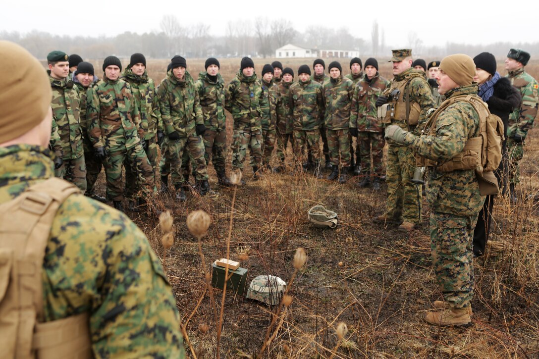 U.S. Marine Corps Chief Warrant Officer Michael Reiser conducts a safety brief to the crowd of U.S. Marines and Moldovans who participated in the workshop prior to a live-fire anti-armor weapons range in Balti, Moldova, Dec. 12, 2014. The Marines and Moldovans built a mutual understanding of firing procedures and characteristics on advanced anti-armor weapons systems, including: Moldova’s Rocket Propelled Grenade system and 70mm Recoiless Rifle and the U.S. FGM-148 Javelin man-portable anti-tank missile, AT-4 Anti-Tank Weapon, and the Shoulder-launched Multipupose Assault Weapon, Dec. 8-12, 2014. Reiser, is an infantry weapons officer assigned to the Black Sea Rotational Force. 
