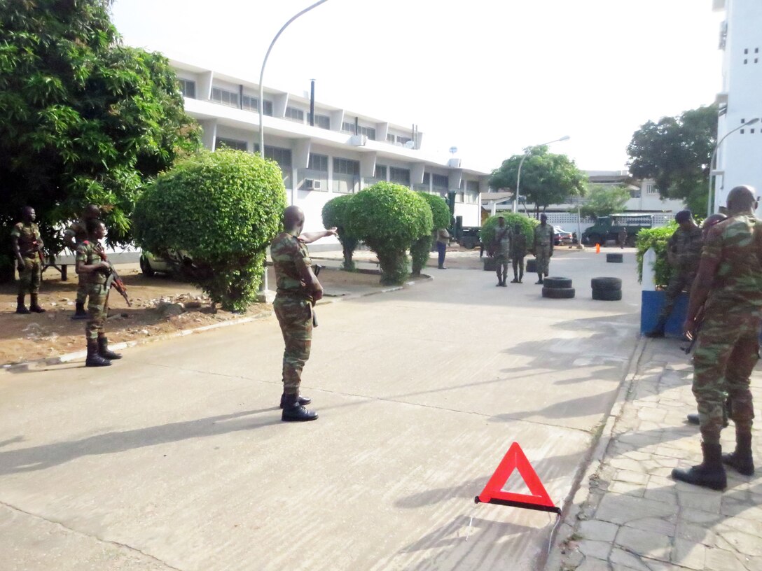 Sailors with the Beninese Navy conduct an Entry Control Point (ECP) exercise in Contonou, Benin, Nov. 27, 2014. Marines with SPMAGTF Crisis Response-Africa conducted the theater security cooperation engagement to help develop and enhance armed sentry skills as the Beninese Navy is preparing to deploy on a peace-keeping mission to the Democratic Republic of Congo (DRC) where they will be standing sentry duties. (Courtesy Photo)