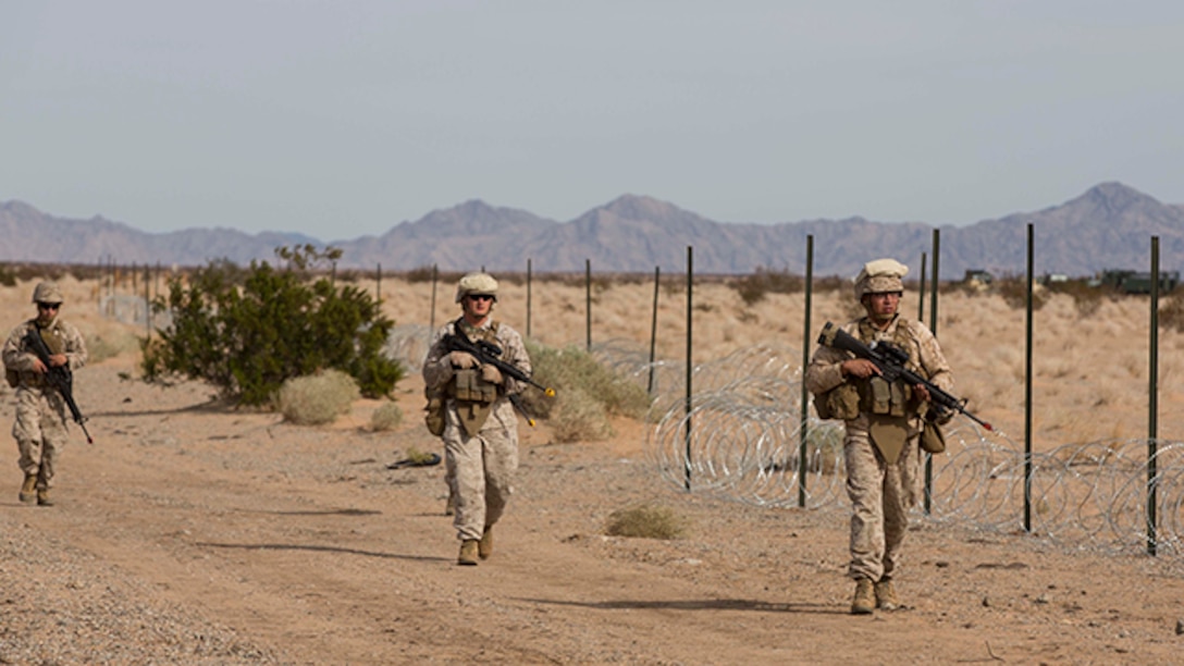 Marines with Marine Wing Support Squadron 371 complete a foot patrol during the security force exercise in support of pre-deployment training Dec. 7-10, 2014, at the Auxiliary Landing Field II on Marine Corps Air Station Yuma, Ariz. (U.S. Marine Corps photo by Cpl. Reba James/ Released)
