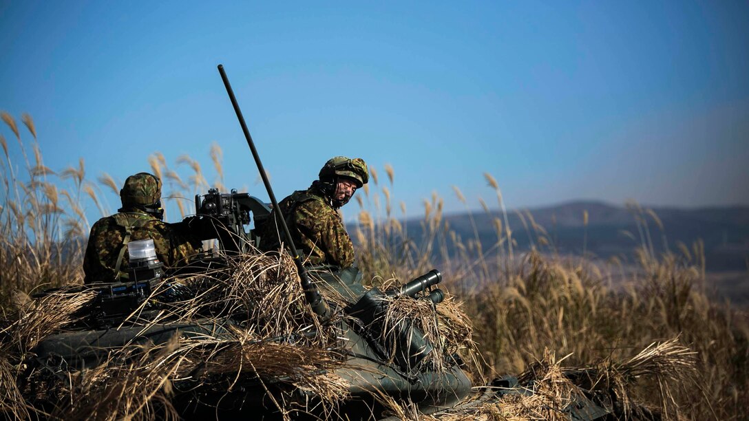 Japan Ground Self-Defense Force members provide forward security Dec. 9 during Forest Light 15-1 at the Oyanohara Training Area in Yamato, Kumamoto prefecture, Japan. Forest Light is a routine, semi-annual exercise designed to enhance the U.S. and Japan military partnership, solidify regional security agreements and improve individual and unit-level skills. The JGSDF members are with 42nd Regiment, 8th Division, Western Army. 
