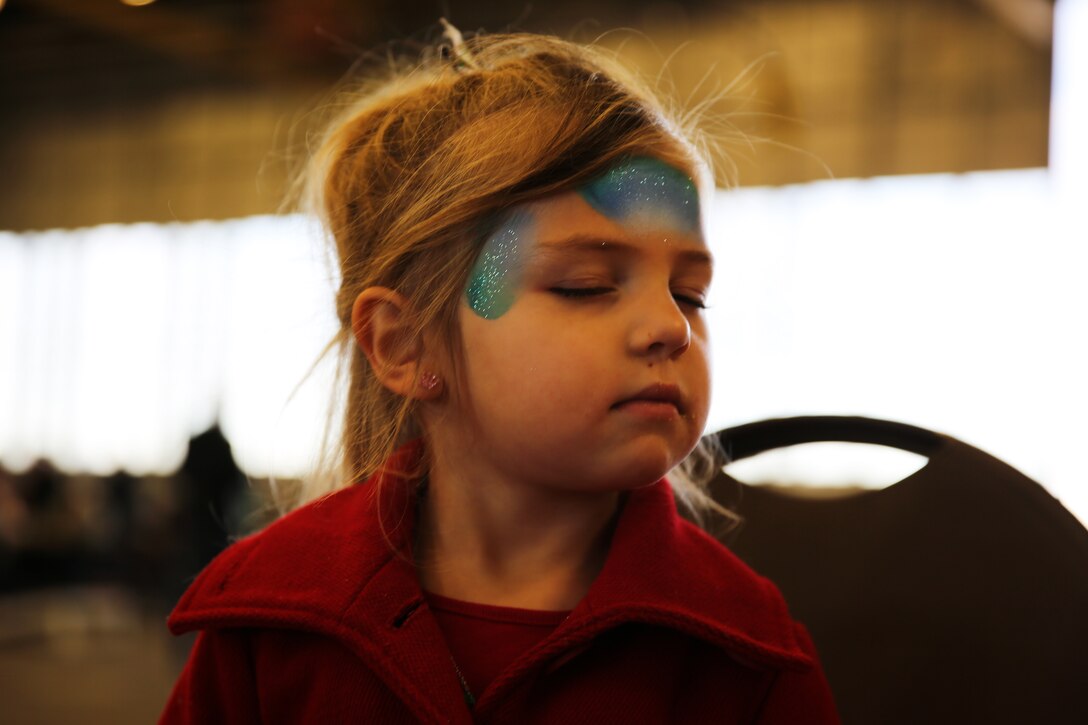 P. Forsee, 4, displays her face paint during Marine Aircraft Group 14’s sixth annual Winter Wonderland at Marine Corps Air Station Cherry Point, N.C., Dec. 12, 2014. MAG-14 hosts the annual event for its 13 squadrons to build esprit de corps and spread the holiday spirit.