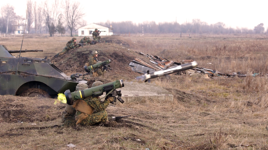 An FGM-148 Javelin man-portable anti-tank missile is fired during the coordinated simulated assault at theAnti-Armor Workshop in Balti, Moldova, Dec. 12.The anti-armor attack integrated U.S. Marines with Moldovan soldiers with various weapons and within minutes the armored targets scattered throughout a vast impact area were blown to pieces by skilled shots from the participants.