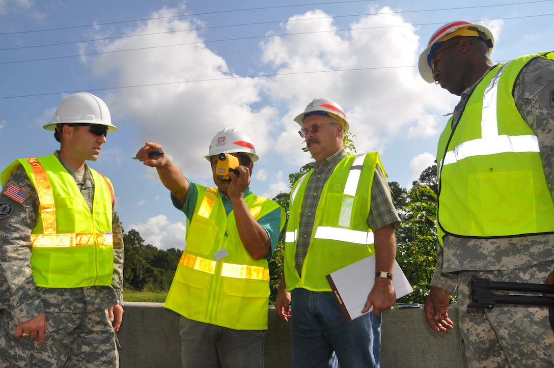 Members of the 542nd FEST-A use a laser finder to obtain measurements of a bridge located during a bridge reconnaissance exercise on Hunter Army Airfield Sept. 18. The team gathered Sept. 15-25 to conduct two weeks of FEST-A training exercises.