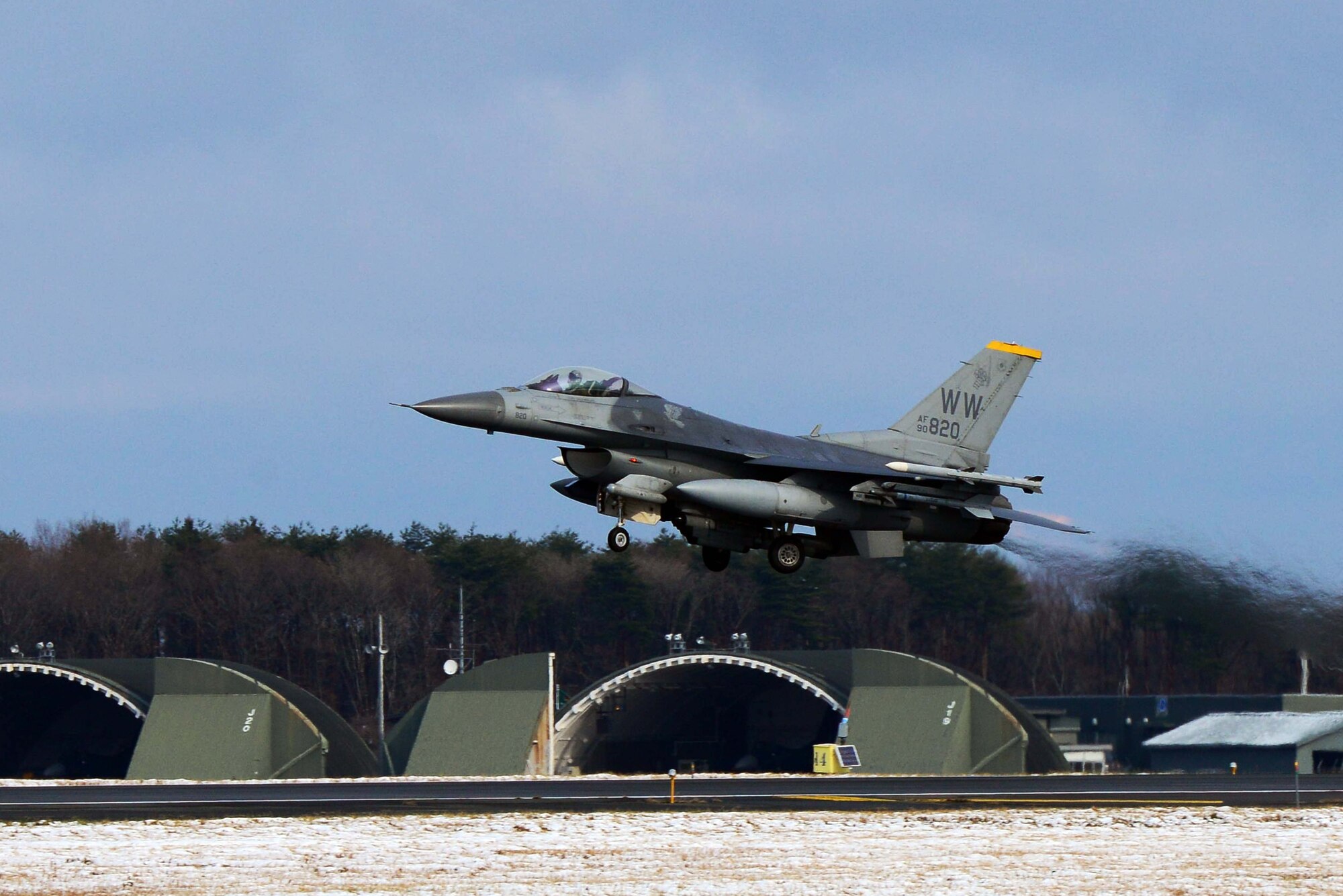 An F-16 Fighting Falcon assigned to the 35th Fighter Wing departs Dec. 4, 2014, from Misawa Air Base, Japan. Numerous F-16s left Misawa for Osan AB, South Korea, in support of Beverly Sunrise 15-1, an exercise that deployed more than 200 Airmen and incorporated five Pacific Air Forces bases. (U.S. Air Force photo/Staff Sgt. Derek VanHorn)