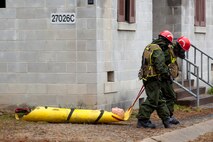 Marines and Sailors with the Chemical Biological Incident Response Force, II Marine Expeditionary Force put their training to use during Exercise Sudden Response aboard Marine Corps Base Quantico on Friday, December 5. Exercise Sudden Response is a Joint Task Force Civil Support exercise designed to challenge the combined forces with multiple scenarios, which could be encountered during a chemical, biological, radiological, nuclear or high-yield explosive incident. CBIRF trained along side the 911th Technical Rescue Engineer Company, the 89th Chemical Company, 3rd Armored Cavalry Regiment, and the 720th Military Police Battalion. CBIRF is prepared to respond, with minimal warning, to any CBRNE event in order to assist local, state, or federal agencies and the geographic combatant commanders in the conduct of CBRNE response or consequence management operations. (Official Marine Corps Photo by Sgt. Kuande L. Hall/RELEASED).