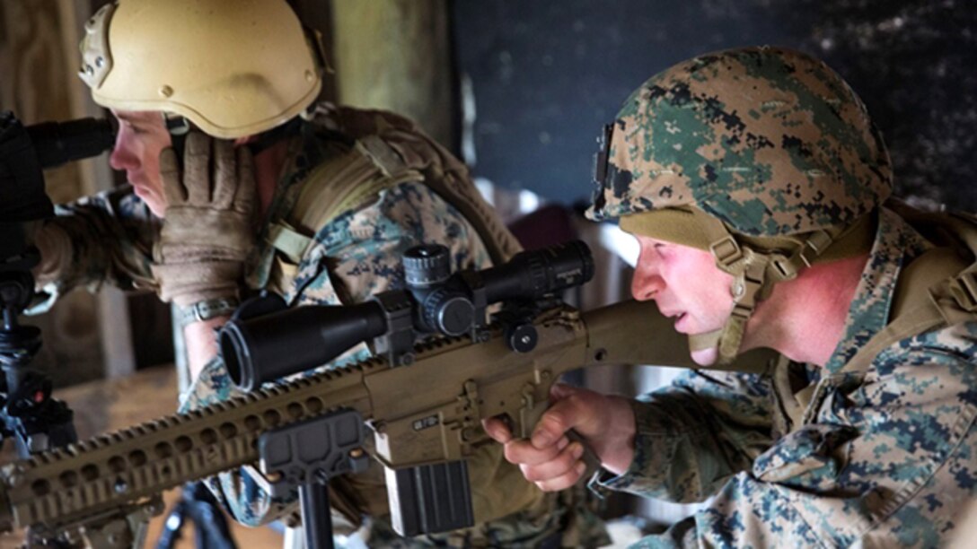 Marines participating in the Expeditionary Operations Training Group Urban Sniper Course take part in the sniper qualification aboard Marine Corps Base Camp Lejeune, N.C., Dec. 4, 2014. The students taking part in the course have to conduct various drills and exercises in a certain time frame while maintaining accuracy. (U.S. Marine Corps photo by Pfc. Immanuel M. Johnson/Released)