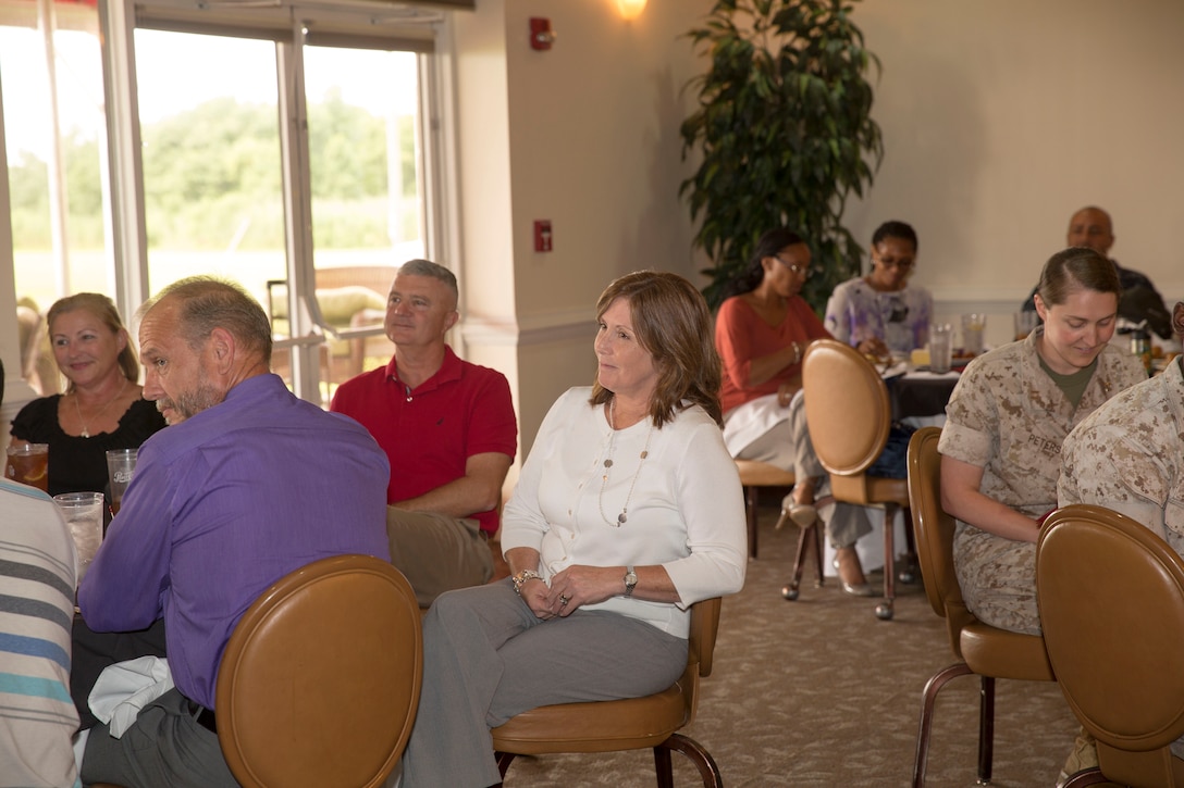 Kathy Zerba, the former office management specialist and community liaison coordinator for Marine Corps Air Station New River’s commanding officer, speaks to guests during a surprise farewell celebration in her honor, at the Eagles Nest Officers’ Club aboard Marine Corps Air Station New River, July 10. Zerba is joining the staff of Naval Hospital Camp Lejeune after nine years of service at MCAS New River.