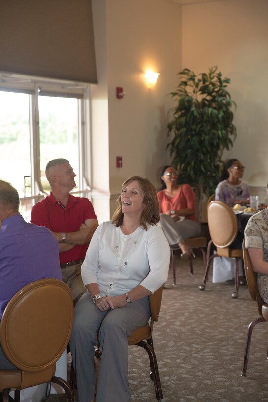 Kathy Zerba, the former office management specialist and community liaison coordinator for Marine Corps Air Station New River’s commanding officer, speaks to guests during a surprise farewell celebration in her honor, at the Eagles Nest Officers’ Club aboard Marine Corps Air Station New River, July 10. Zerba is joining the staff of Naval Hospital Camp Lejeune after nine years of service at MCAS New River.