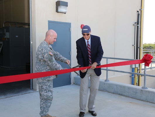 Jacksonville District commander Col. Alan Dodd and South Florida Water Management District Executive Director Blake Guillory cut a ribbon to celebrate the completion of the first major construction contract for the Picayune Strand Restoration Project.