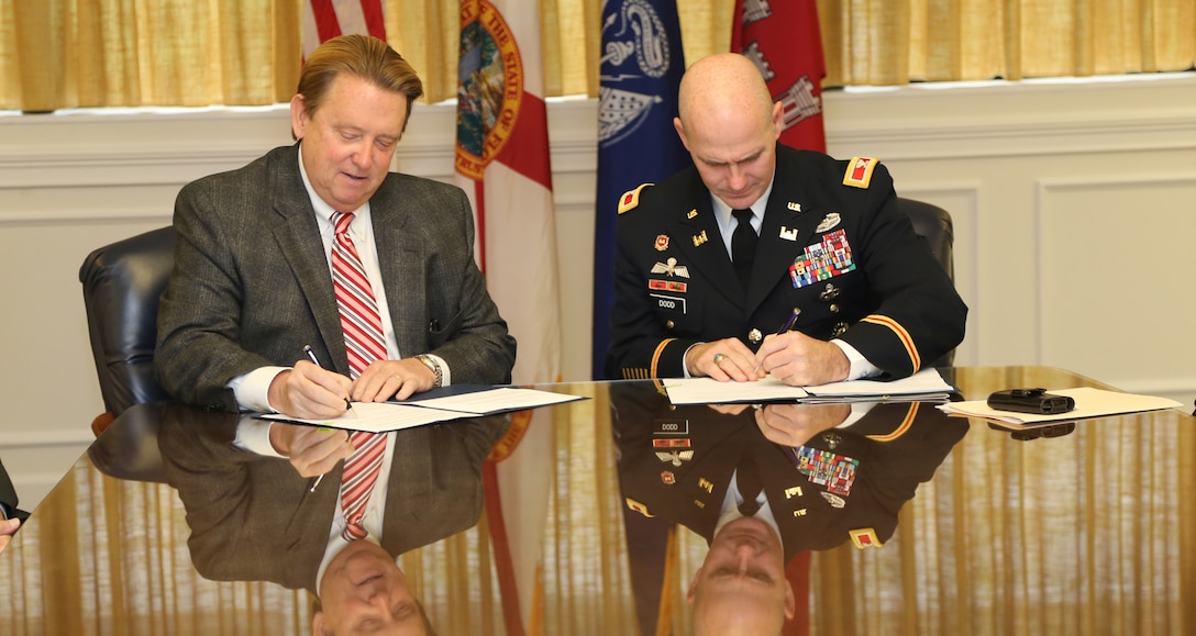 University of North Florida (UNF) President John A. Delaney (left) and Col. Alan M. Dodd (right), Commander, Jacksonville District, U.S. Army Corps of Engineers signed a Memorandum of Understanding on November 25, 2014, in order to advance educational opportunities between the Corps and UNF in STEM subject areas – math, science, engineering and technology – for developing student scientists and engineers.