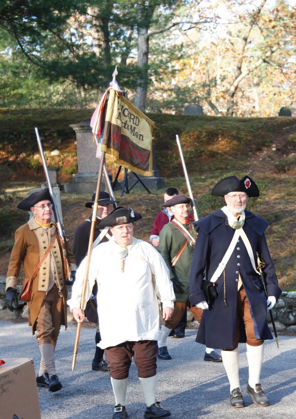 The Concord Minutemen move into position during the parade into Sleepy Hollow Cemetery Col. Christopher Barron represented the New England District in the Flag Retirement Ceremony held on Veterans Day at Sleepy Hollow Cemetery in Concord, Mass.  Col. Barron spoke to the crowd urging everyone to honor Veterans, not just on Veterans Day, but every day.
