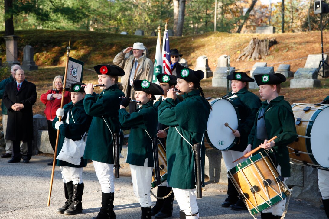 The Middlesex County 4-H Fife & Drum Corps perform musical selections during the Flag Retirement Ceremony  Col. Christopher Barron represented the New England District in the Flag Retirement Ceremony held on Veterans Day at Sleepy Hollow Cemetery in Concord, Mass.  Col. Barron spoke to the crowd urging everyone to honor Veterans, not just on Veterans Day, but every day.
