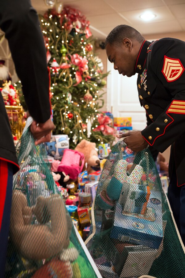 Staff Sgt. Sylvester T. Dollard, the security administrative staff noncommissioned officer in charge at Marine Forces Reserve, packs donated toys at the Patrick F. Taylor Foundation building in New Orleans, Dec. 16, 2014. The new, unwrapped toys will be distributed through the Marine Corps Reserve’s Toys for Tots program to less fortunate children in the New Orleans community. 