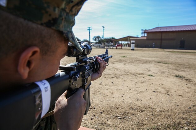 Recruit Bryan A. Soberaniperez, Platoon 1049, Charlie Company, 1st Recruit Training Battalion, sights in during “snap-in-time” at Marine Corps Base Camp Pendleton,Calif., Nov. 24. The instructors gave recruits “snap-in-time” so they could practice the different position and fundamentals they were taught. During “snap-in-time,” recruits aimed in at barrels with targets painted on them simulating the targets at different yard lines.