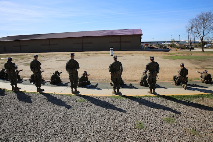 Recruits of Charlie Company, 1st Recruit Training Battalion, use their “snap-in-time” to practice the sitting position at Marine Corps Base Camp Pendleton,Calif., Nov. 24 The instructors gave recruits “snap-in-time” so they could practice the different position and fundamentals they were taught. During “snap-in-time,” recruits aimed in at barrels with targets painted on them simulating the targets at different yard lines