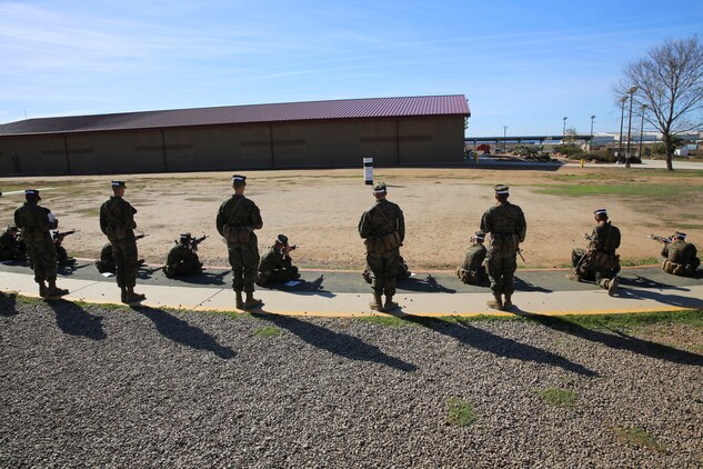 Recruits of Charlie Company, 1st Recruit Training Battalion, use their “snap-in-time” to practice the sitting position at Marine Corps Base Camp Pendleton,Calif., Nov. 24 The instructors gave recruits “snap-in-time” so they could practice the different position and fundamentals they were taught. During “snap-in-time,” recruits aimed in at barrels with targets painted on them simulating the targets at different yard lines
