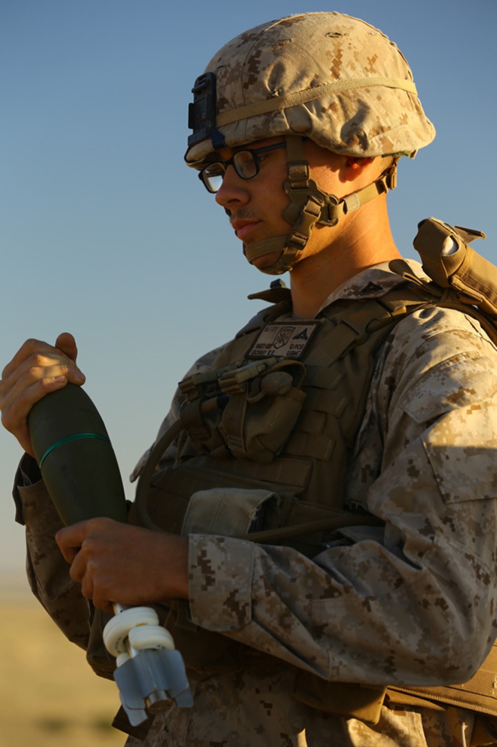 A U.S. Marine with Weapons Company, Battalion Landing Team 2nd Battalion, 1st Marines, 11th Marine Expeditionary Unit (MEU), prepares an 81mm mortar round during a joint mortar range with Royal Saudi Naval Forces Marines with the 3rd Marine Infantry Battalion during exercise Red Reef 15 in the U.S. 5th Fleet area of responsibility, Dec 12, 2014. Red Reef is part of a routine theater security cooperation engagement plan between the U.S. Navy, U.S. Marine Corps and Royal Saudi Naval Forces that serves as an excellent opportunity to strengthen tactical proficiency in critical mission areas and support long-term regional security.
 (U.S. Marine Corps photo by Cpl. Jonathan R. Waldman/Released)
