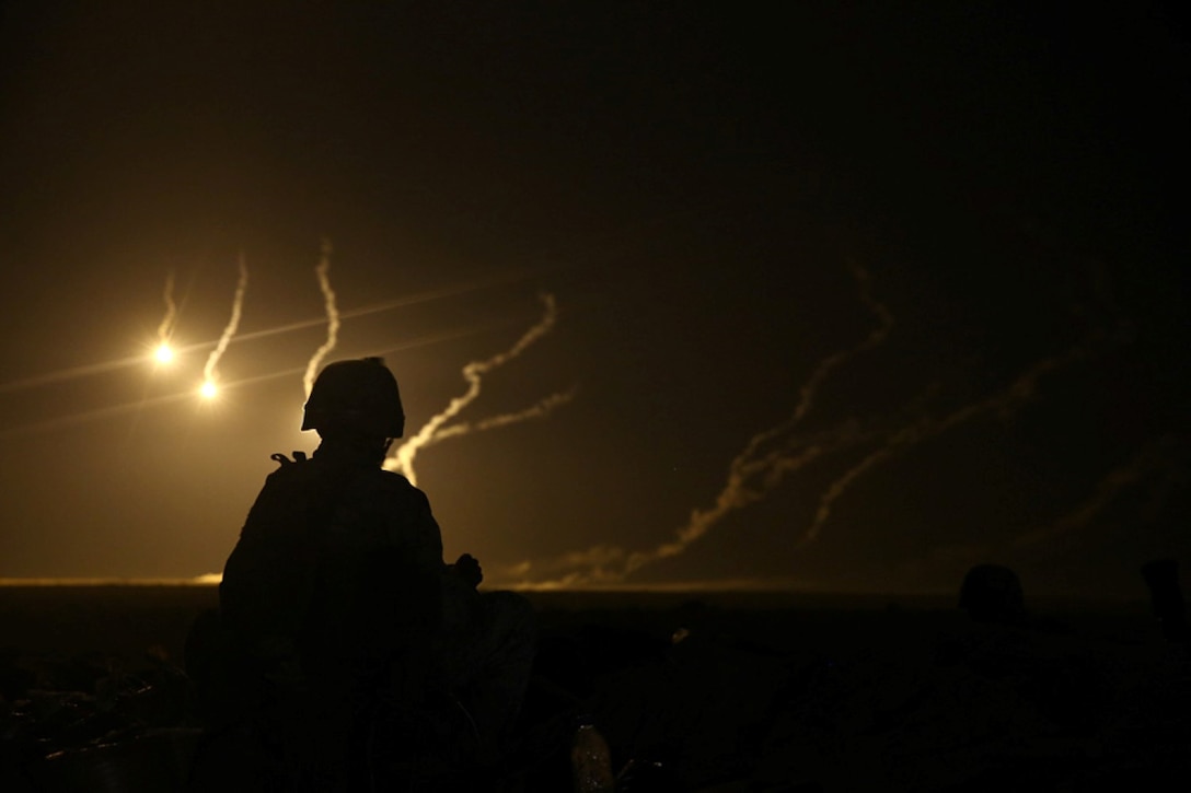 A U.S. Marine with Weapons Company, Battalion Landing Team 2nd Battalion, 1st Marines, 11th Marine Expeditionary Unit (MEU), watches 81mm illumination mortar rounds fall during a joint mortar range with Royal Saudi Naval Forces Marines with the 3rd Marine Infantry Battalion during exercise Red Reef 15 in the U.S. 5th Fleet area of responsibility, Dec 12, 2014. Red Reef is part of a routine theater security cooperation engagement plan between the U.S. Navy, U.S. Marine Corps and Royal Saudi Naval Forces that serves as an excellent opportunity to strengthen tactical proficiency in critical mission areas and support long-term regional security.
 