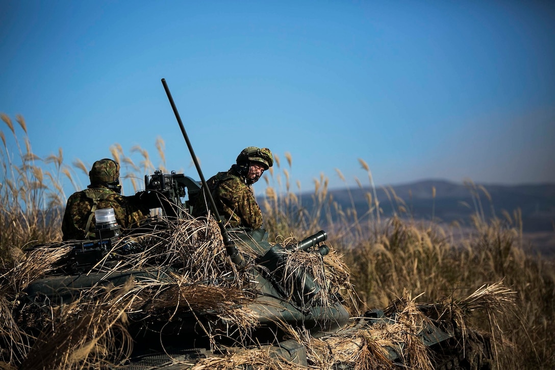 Japan Ground Self-Defense Force members provide forward security Dec. 9 during Forest Light 15-1 at the Oyanohara Training Area in Yamato, Kumamoto prefecture, Japan. Forest Light is a routine, semi-annual exercise designed to enhance the U.S. and Japan military partnership, solidify regional security agreements and improve individual and unit-level skills. The JGSDF members are with 42nd Regiment, 8th Division, Western Army. 