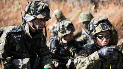 YAMATO,Japan (Dec. 9, 2014) - Japan Ground Self-Defense Force members discuss a plan of attack during Forest Light 15-1 at the Oyanohara Training Area.  Forest Light is a routine, semi-annual exercise designed to enhance the U.S. and Japan military partnership, solidify regional security agreements and improve individual and unit-level skills. The JGSDF members are with 42nd Regiment, 8th Division, Western Army.   141209-M-GX711-108