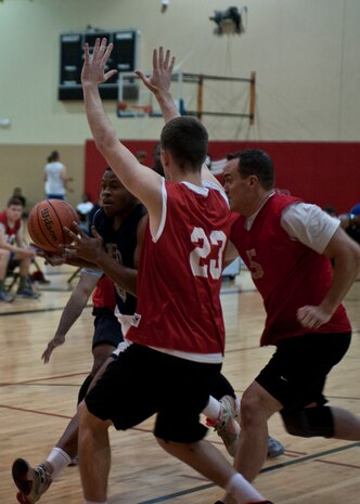 Nathaniel Mills, 99th Security Forces Squadron team captain, drives toward the basket during an intramural basketball game against the 57th Operations Support Squadron at Nellis Air Force Base, Nev., Dec. 15, 2014. Mills led the 99th SFS to a 61-44 victory with 26 points and 15 rebounds. The 99th SFS’ victory improves their record to 1-1 for this year’s intramural basketball season, which kicked off Dec. 8. (U.S. Air Force photo by Staff Sgt. Siuta B. Ika)