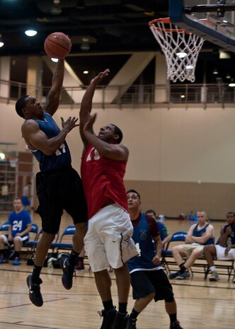 Jan Lanier, 99th Security Forces Squadron guard, goes up for a dunk during an intramural basketball game against the 57th Operations Support Squadron at Nellis Air Force Base, Nev., Dec. 15, 2014. The 99th SFS, which defeated the 57th OSS 61-44, is looking for redemption following their loss in last season’s semifinals. The intramural basketball season kicked off at Nellis AFB Dec. 8. (U.S. Air Force photo by Staff Sgt. Siuta B. Ika)