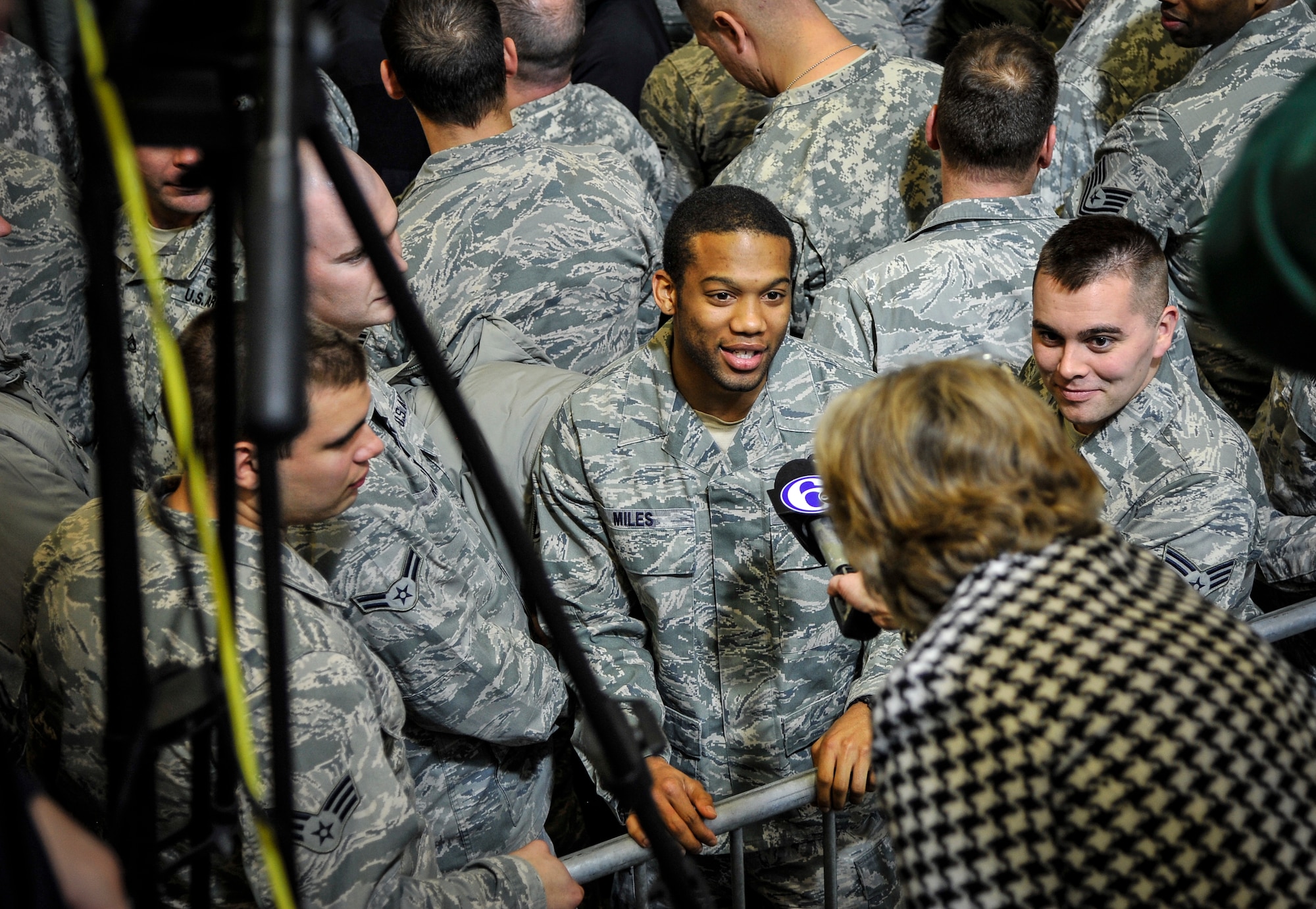 Airmen from Joint Base McGuire-Dix-Lakehurst, N.J., answer questions during an interview before United States of America President Barack Obama addresses  a crowd of more than 3,000 people at JB MDL Dec. 15, 2014. The president visited the joint base to express his gratitude to service members and Department of Defense civilians for serving their country. (U.S. Air Force photo by Staff Sgt. Scott Saldukas/Released)