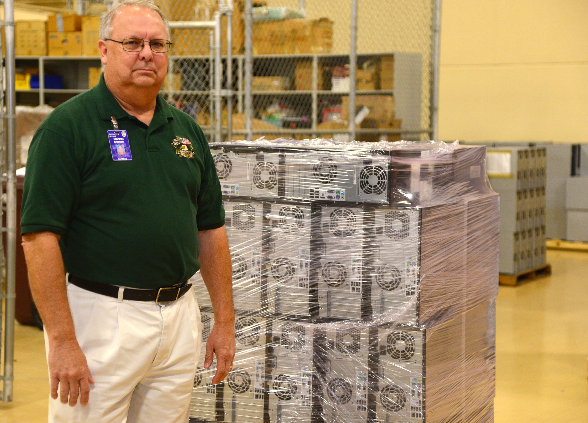 VANCE AIR FORCE BASE, Okla. -- Capt. David Baisden, who is in charge of support services for the Oklahoma County Sheriff, stands with a pallet of computers he is picking up. Baisden was browsing the Defense Logistics Agency program when he saw 102 computers available at Vance. Through the DLA he was able to pick up the computers for $3,003.90. (U.S. Air Force/photo Senior Airman Frank Casciotta)